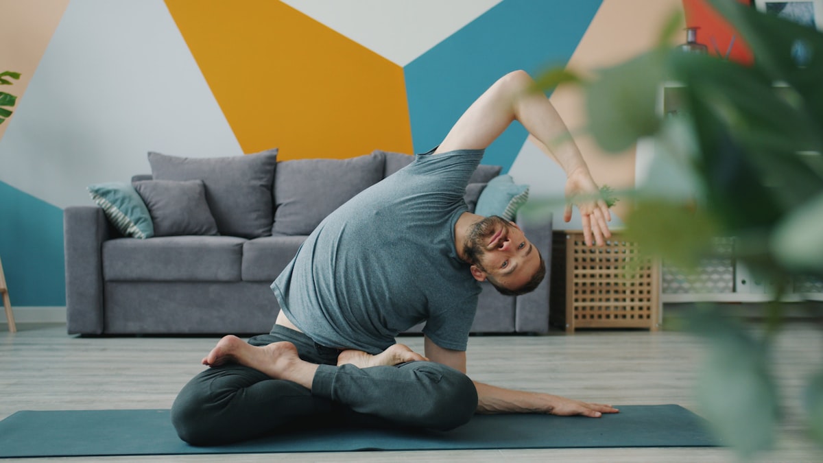 Mature man practicing yoga in a calm studio