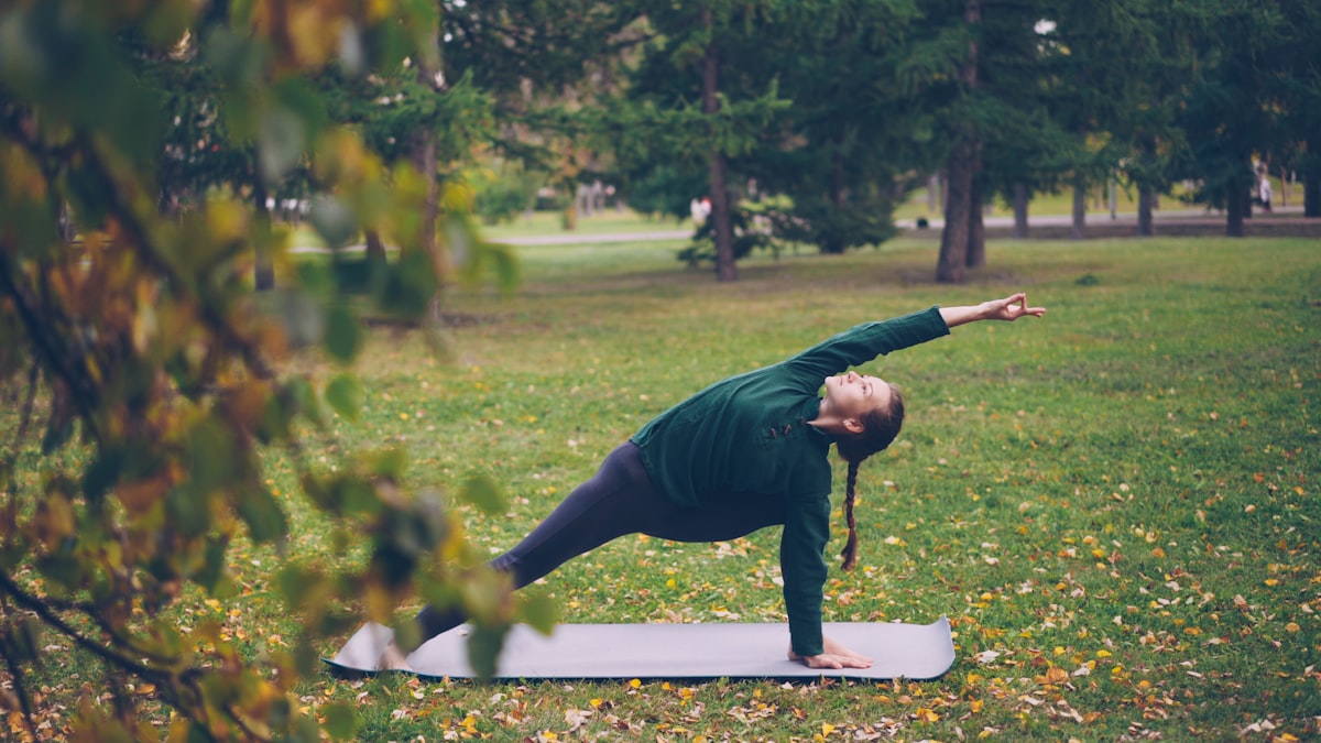 Man practicing yoga poses at home